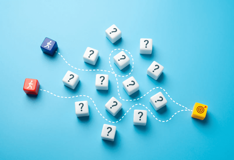 a group of dice with question marks